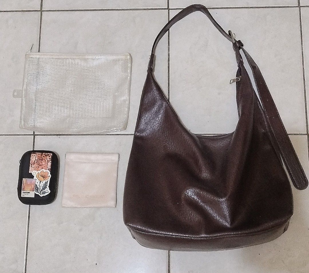 Shoulder Bag w/ 3 pouches (Category: Purses & Pouches) located in Quezon City. Submitted by aishlatte (Listing ID 1462115526, Image 1). Description: All are used. > Shoulder bag -Adjustable Strap, can be sling bag > 3pcs Pouches - (Black has stickers on it) All for ₱150.