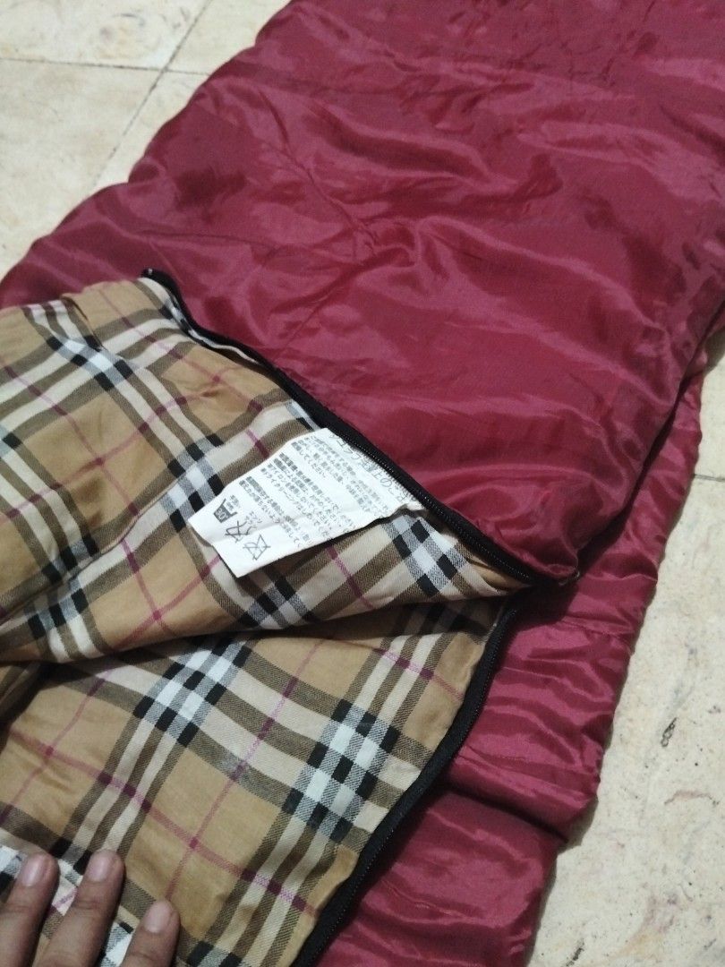 Sleeping Bag with Carry Bag (Category: Hiking & Camping) located in Abucay. Submitted by cristineca20489 (Listing ID 1462248695, Image 2). Description: - BUNDOK sleeping bag - Includes a convenient carry bag - Features a stylish plaid inner lining - Ideal for camping and outdoor adventures - Lightweight and easy to pack for transport - 300 each.