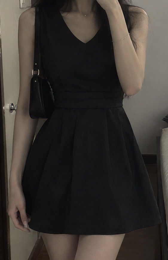 Sleeveless Black V-Neck Mini Dress (Category: Dresses) located in Manila. Submitted by solvithrifts (Listing ID 1462205129, Image 1). Description: - Classic black sleeveless dress - Elegant V-neckline - Flattering cinched waist - Flowy, pleated A-line skirt - Above-the-knee length - Versatile for dressing up or down - Effortless to accessorize.