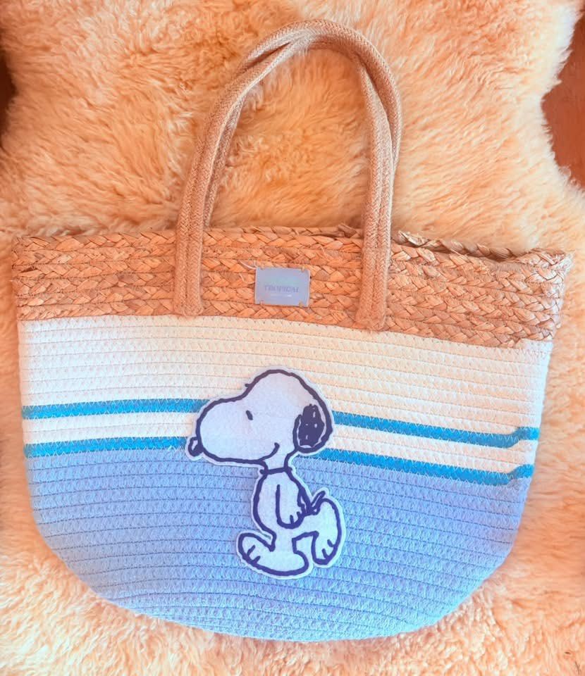 Snoopy Straw Tote Bag - Summer Beach Bag (Category: Tote Bags) located in Baguio. Submitted by izza_thrifty (Listing ID 1462054492, Image 3). Description: - Cute Snoopy straw tote bag - Perfect for beach days or everyday use - Features blue and white stripes - Woven straw top - Sturdy rope handles - Ideal for carrying essentials in style - Fun accessory for Snoopy fans.