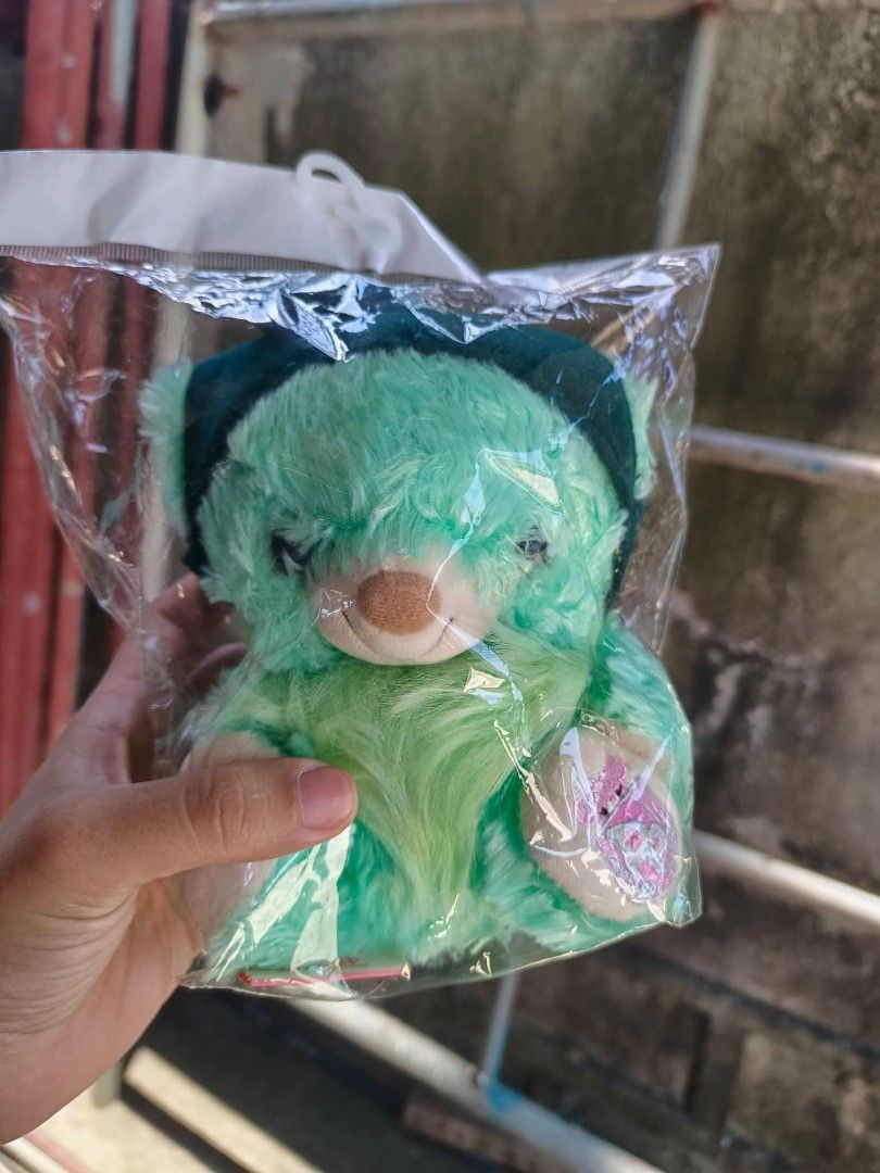 Snow white unibearsity (Category: Plushies & Soft Toys) located in Daet. Submitted by heracaramel (Listing ID 1462245433, Image 1). Description: - Adorable green bear plush toy - Brand new, still in original packaging - Features a small embroidered patch on its paw - Tag reads 'Snowy Bear' - Ideal for collectors or as a thoughtful gift.
