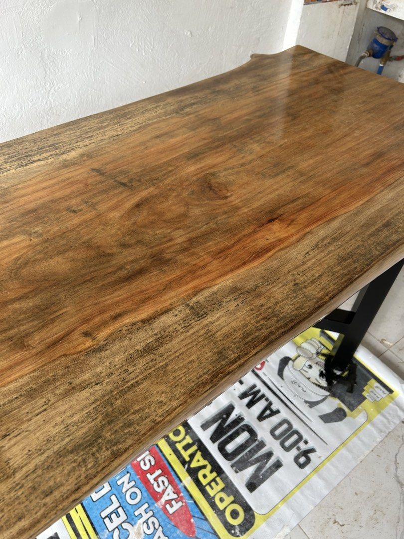 Solid Wood Table with Black Metal Legs (Category: Tables & Sets) located in Bulacan. Submitted by peach1025 (Listing ID 1462090316, Image 2). Description: - Beautiful solid NARRA wood table with natural grain finish - Unique live edge design - Sturdy black metal legs - Versatile: great for dining or as a workspace - Dimensions: Approx. [insert length] x [insert width] x [insert height].