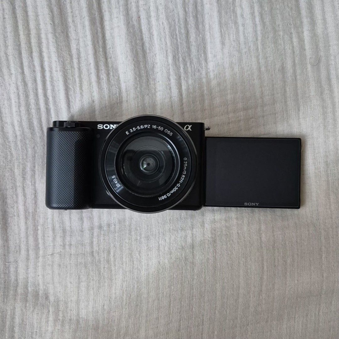 Sony ZV-E10 Mirrorless Camera with 16-50mm Lens (Category: Cameras) located in Quezon City. Submitted by livesunlit (Listing ID 1462111079, Image 1). Description: - Sony ZV-E10 Camera Body - Includes 16-50mm Power Zoom Lens - Comes with 2 Batteries - Includes Charger - Strap included - Lens cap included - screen protector on LCD included - Ideal for Vlogging & Content Creation - Ready to shoot out of the box!.