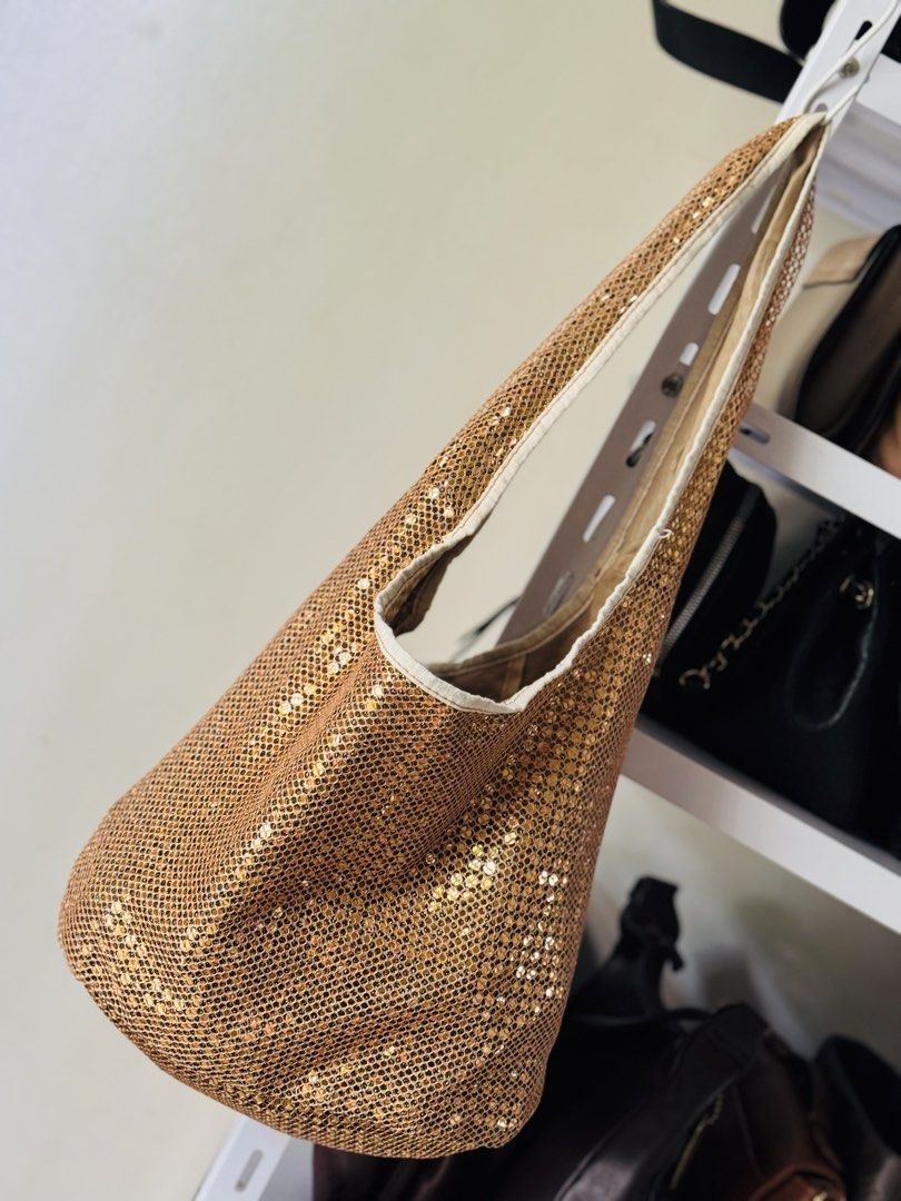 Sparkly Gold Sequin Hobo Bag (Category: Shoulder Bags) located in Bacolod City. Submitted by vintage_vogue6100 (Listing ID 1462139324, Image 3). Description: - Eye-catching gold sequins with a chic mesh overlay - Versatile hobo bag style - Neutral interior lining - Convenient interior zippered pocket and slip pocket - Adds instant glamour to any outfit, day or night.