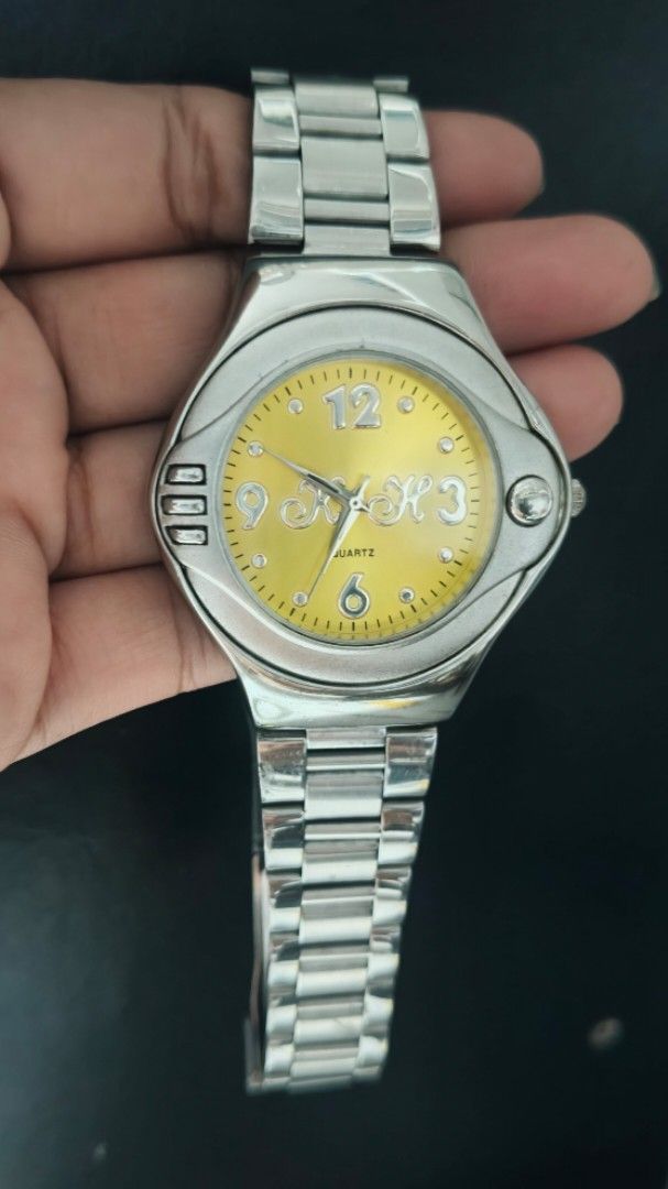 Sport Quartz Watch Yellow Dial (Category: Men's Watches) located in Taguig. Submitted by mercyeugen28914 (Listing ID 1462134142, Image 3). Description: - Silver tone metal watch - Vibrant yellow dial - Reliable quartz movement - Matching silver tone metal band - Clasp engraved with 'SPORT' - Minor signs of wear on the band - Ideal for everyday wear.