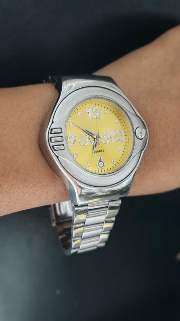 Sport Quartz Watch Yellow Dial (Category: Men's Watches) located in Taguig. Submitted by mercyeugen28914 (Listing ID 1462134142, Image 1). Description: - Silver tone metal watch - Vibrant yellow dial - Reliable quartz movement - Matching silver tone metal band - Clasp engraved with 'SPORT' - Minor signs of wear on the band - Ideal for everyday wear.