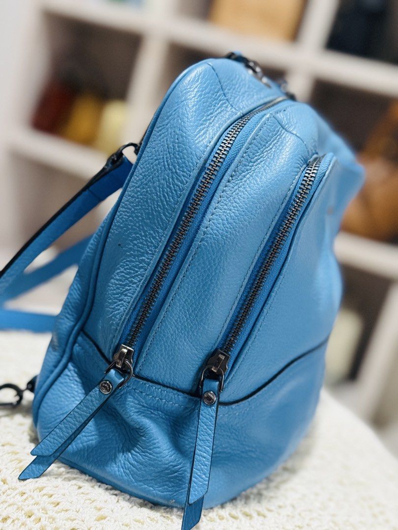 S.S Blue Leather Backpack (Category: Backpacks) located in Bacolod City. Submitted by vintage_vogue6100 (Listing ID 1462139315, Image 3). Description: - Genuine blue leather backpack - Front zip pocket for quick access - Two spacious main zip compartments for organization - Adjustable straps for versatile wear - Can be styled as a backpack or a shoulder bag with chain detail - Ideal size for everyday essentials.