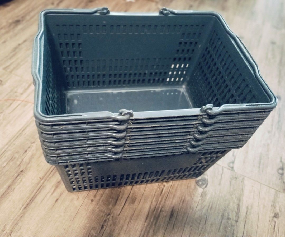 Stackable Plastic Shopping Baskets (Category: Storage Boxes & Baskets) located in Singapore. Submitted by adeqleo (Listing ID 1462046790, Image 1). Description: 6 Sets of dark grey plastic shopping baskets. Stacks for easy storage. Durable and sturdy. Great for organizing or small shops. Self collect at 760283. .