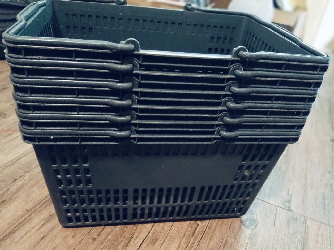 Stackable Plastic Shopping Baskets (Category: Storage Boxes & Baskets) located in Singapore. Submitted by adeqleo (Listing ID 1462046790, Image 2). Description: 6 Sets of dark grey plastic shopping baskets. Stacks for easy storage. Durable and sturdy. Great for organizing or small shops. Self collect at 760283. .