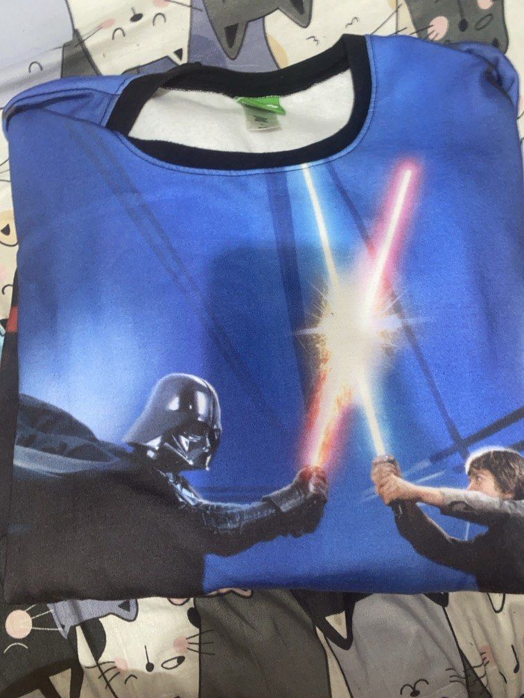 STAR WARS (Category: Tshirts & Polo Shirts ) located in Manila. Submitted by maui2loco (Listing ID 1462240583, Image 1). Description: Star Wars graphic t-shirt featuring an all-over print of the iconic lightsaber duel between Luke Skywalker and Darth Vader.