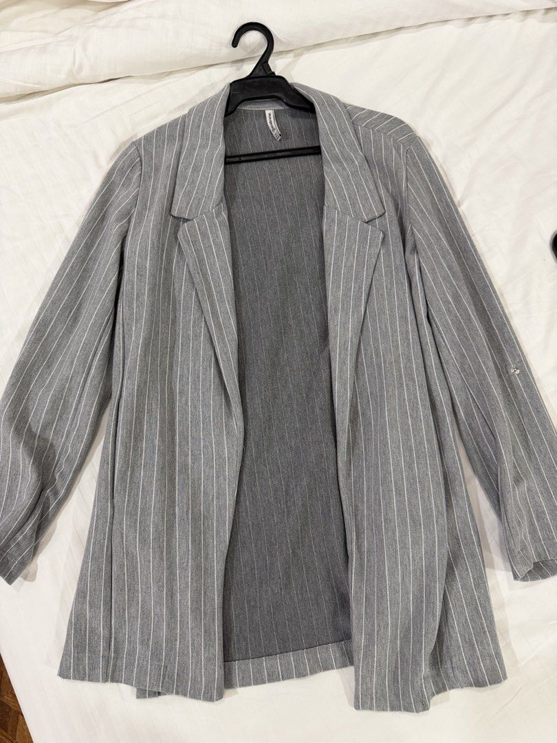 Stradivarius Pinstripe Blazer (Category: Coats, Jackets and Outerwear) located in Quezon City. Submitted by ayybee_closet (Listing ID 1462114412, Image 1). Description: - Used a few times but like new. No damages. - Soft cotton fabric with foldable sleeves (has a button you can clasp) - Ends in waist area on a 5 footer.