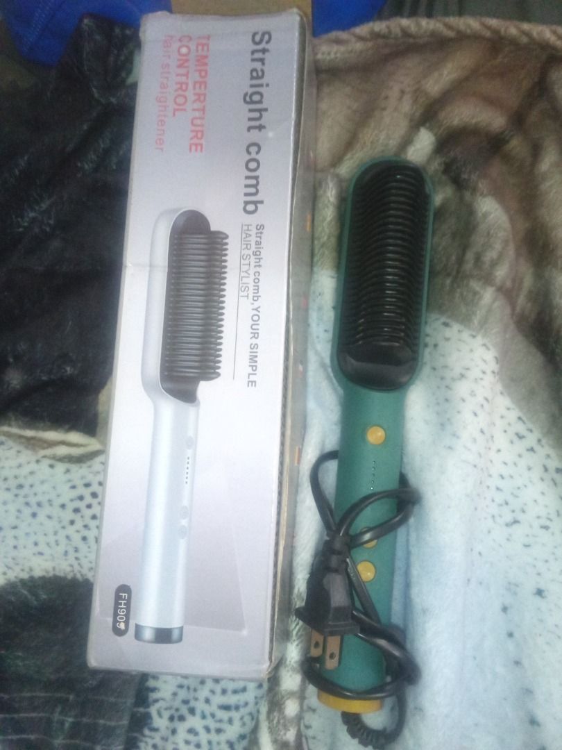 Straight Comb Hair Stylist with Temperature Control (Category: Hair) located in Caloocan City. Submitted by giaregala03 (Listing ID 1462203472, Image 1). Description: - FH909 Straight Comb Hair Stylist - Effortlessly straightens hair - Adjustable temperature control - Easy-to-use yellow buttons on handle - Green comb with black cord and plug - Original box included (shows white comb on packaging).