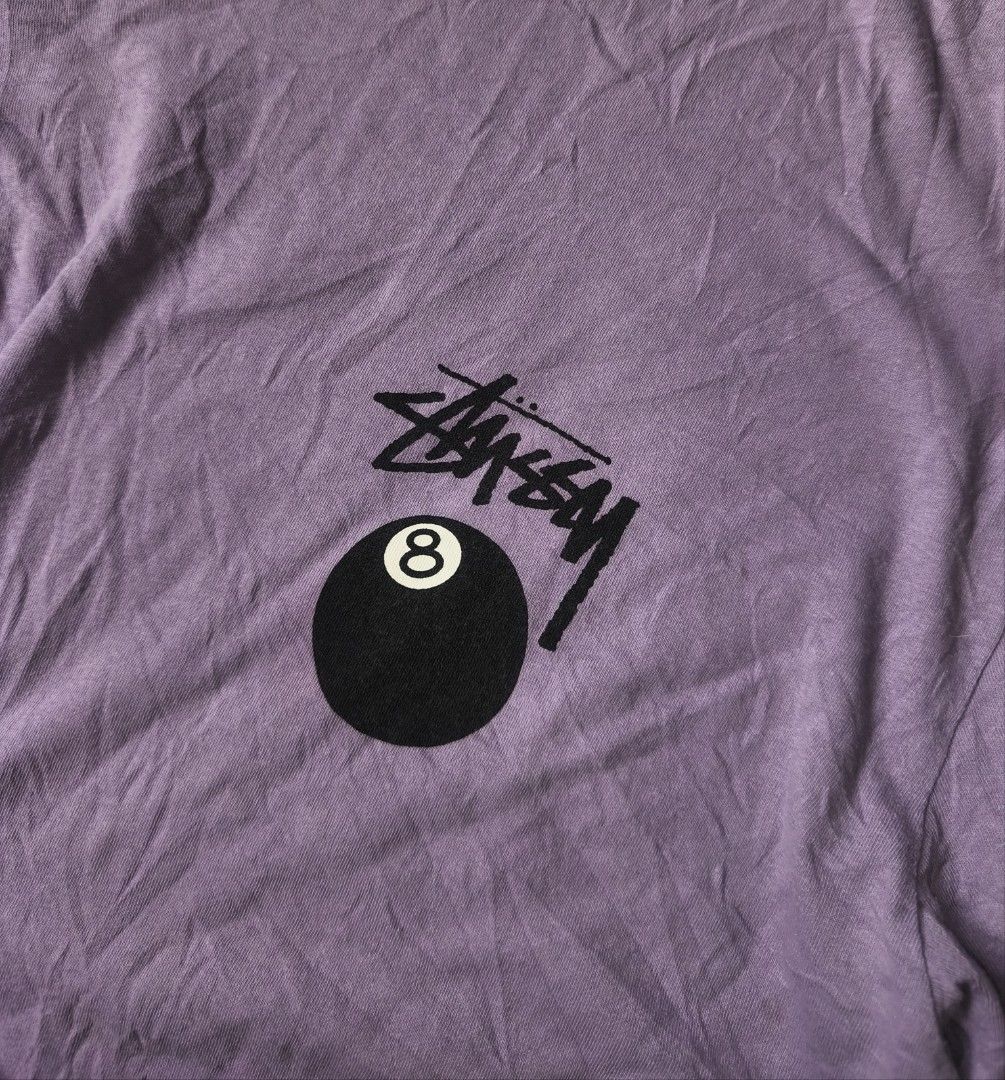 stussy 8 ball tee (Category: Tshirts & Polo Shirts ) located in Cagayan de Oro. Submitted by elijah350below (Listing ID 1462180439, Image 3). Description: Stussy t-shirt in a light purple color. Features the iconic 8-ball graphic on the front and back. Made in China. Size XL. Made of cotton. Includes care instructions on the tag. The shirt has a crew neck and short sleeves. xl 23x31 excellent no issues payment: Gcash courier: J&T color may vary d