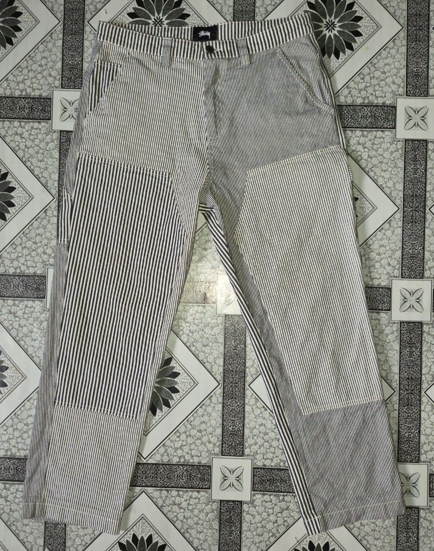 Stussy Patchwork Striped Carpenter Pants (Category: Jeans) located in Ilagan. Submitted by culalabejen05 (Listing ID 1462125965, Image 2). Description: - Stussy Carpenter Pants - Unique patchwork design - Classic navy and white pinstripe pattern - Multiple practical pockets - Relaxed fit for everyday comfort - Size: 32 Best fit 34 - Made in China.