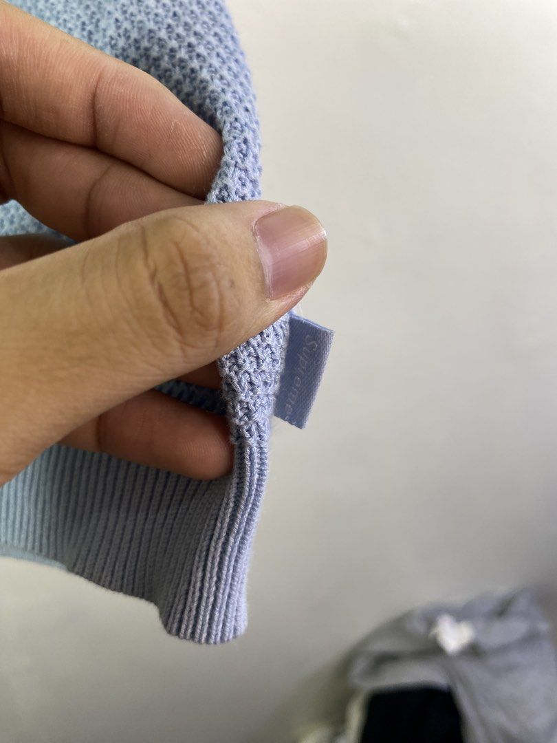 Supreme Knit Polo Sweater Light Blue M (Category: Coats, Jackets and Outerwear) located in Manila. Submitted by declutterpromax (Listing ID 1462110562, Image 3). Description: - Supreme knit polo sweater - Light blue color with textured pattern - Quarter zip closure - Ribbed cuffs and hem - Size Medium - Ideal for layering or standalone wear.