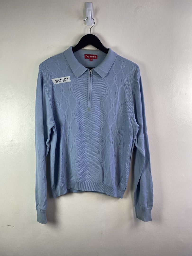 Supreme Knit Polo Sweater Light Blue M (Category: Coats, Jackets and Outerwear) located in Manila. Submitted by declutterpromax (Listing ID 1462110562, Image 1). Description: - Supreme knit polo sweater - Light blue color with textured pattern - Quarter zip closure - Ribbed cuffs and hem - Size Medium - Ideal for layering or standalone wear.