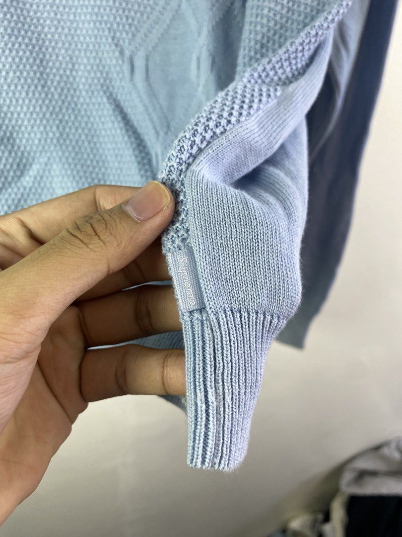 Supreme Knit Polo Sweater Light Blue M (Category: Coats, Jackets and Outerwear) located in Manila. Submitted by declutterpromax (Listing ID 1462110562, Image 2). Description: - Supreme knit polo sweater - Light blue color with textured pattern - Quarter zip closure - Ribbed cuffs and hem - Size Medium - Ideal for layering or standalone wear.