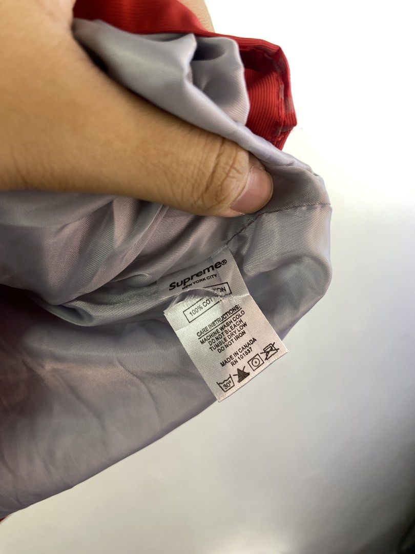 Supreme Triple-Layer Waterproof Breathable Jacket Size M (Category: Coats, Jackets and Outerwear) located in Manila. Submitted by declutterpromax (Listing ID 1462110556, Image 3). Description: - Supreme Triple-Layer Jacket - Waterproof & Breathable - All-over Red Supreme Logo Print - Size: Medium (M) - Made in China - Ideal for Rainy Days & Outdoor Activities.