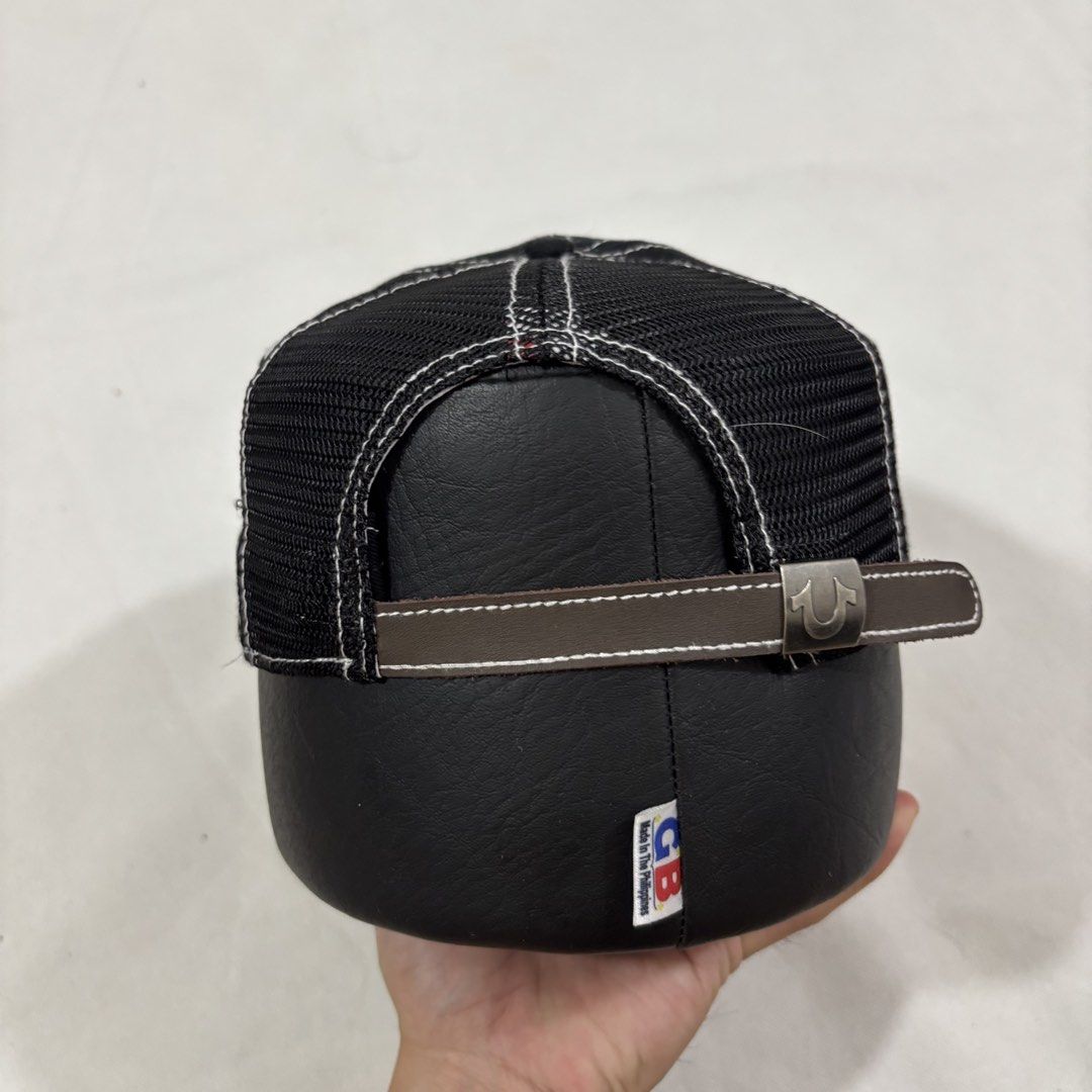 Supreme x True religion Cap Black White Stitching Studs (Category: Caps & Hats) located in Cavite. Submitted by itsayaaa (Listing ID 1462094232, Image 3). Description: - Black trucker cap with white contrast stitching - Features a 'Supreme' logo with metal stud accents - Mesh back for enhanced breathability - Adjustable strap for a customized fit - Interior lining with a red graphic print Supreme x True religion .