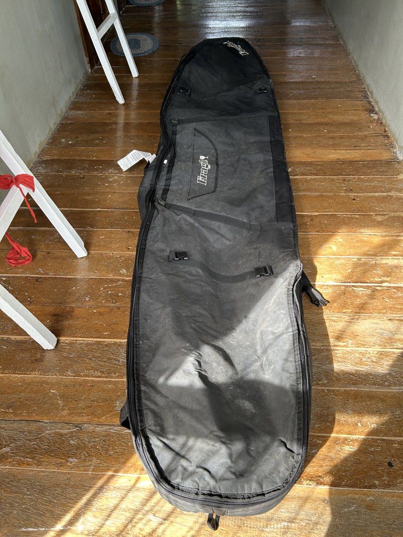 Surfboard Bag (Category: Water Sports) located in Surigao. Submitted by chastnavarrete (Listing ID 1462223056, Image 1). Description: - surfboard bag - Color: Black exterior, silver interior - Padded for maximum protection - Fits two longboard - Full zip-around closure - Features carry handles and a shoulder strap - Ideal for travel and storage - Protects your surfboard from dings and sun damage.