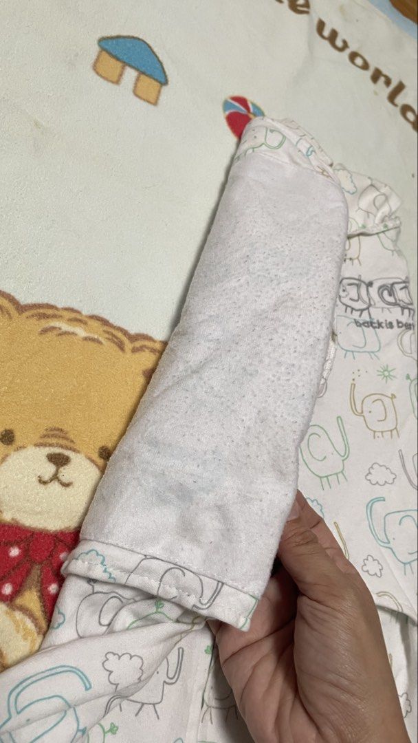 Swaddle Designs "Back is Best" Baby Swaddle (Category: Babies & Kids Fashion) located in San Jose del Monte. Submitted by momma_buys (Listing ID 1462114146, Image 3). Description: - Swaddle Designs "Back is Best" swaddle - Adorable elephant print - Size: NB (Newborn), fits 6-12 lbs - Material: 100% Cotton - Features: Zipper closure for easy diaper changes - Benefit: Keeps your baby snug and secure.