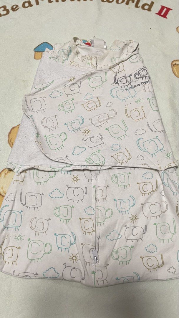 Swaddle Designs "Back is Best" Baby Swaddle (Category: Babies & Kids Fashion) located in San Jose del Monte. Submitted by momma_buys (Listing ID 1462114146, Image 1). Description: - Swaddle Designs "Back is Best" swaddle - Adorable elephant print - Size: NB (Newborn), fits 6-12 lbs - Material: 100% Cotton - Features: Zipper closure for easy diaper changes - Benefit: Keeps your baby snug and secure.