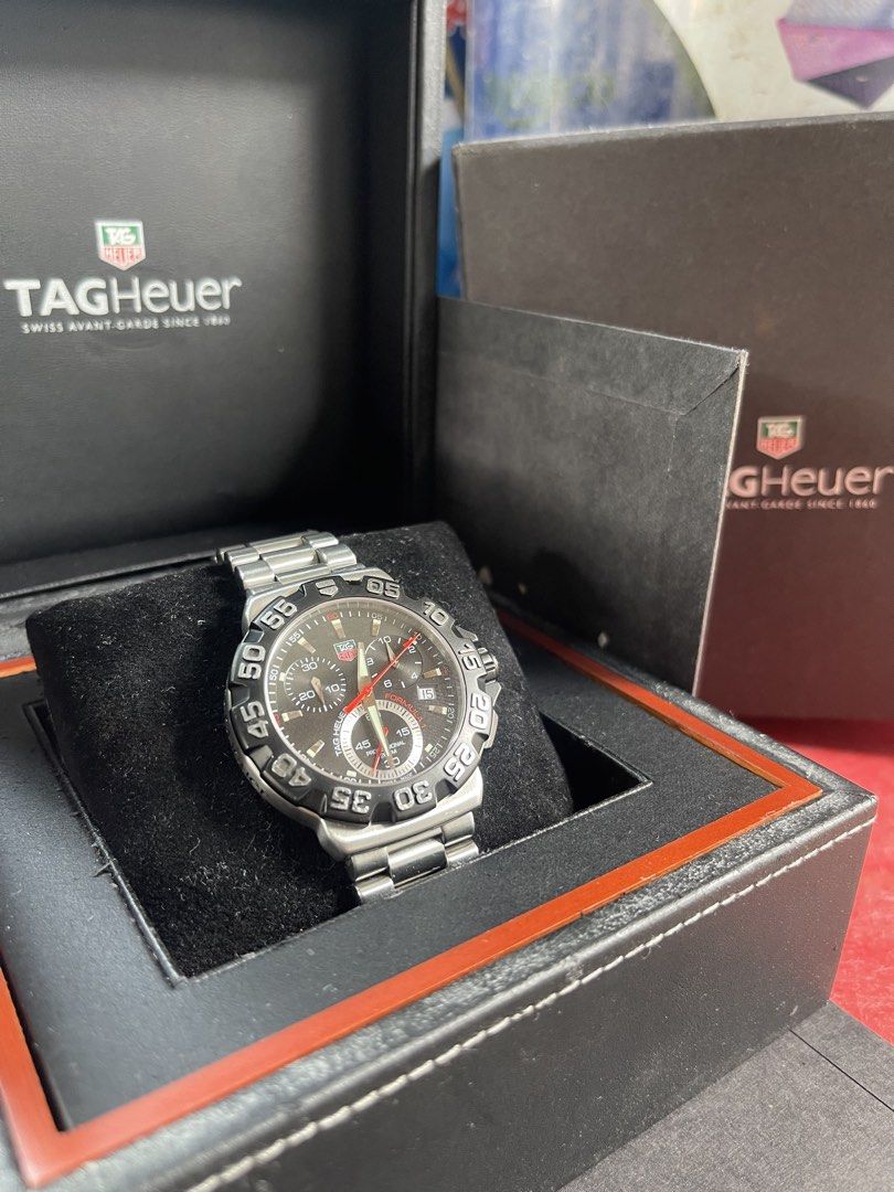 TAG Heuer Formula 1 Professional Watch (Category: Men's Watches) located in Manila. Submitted by crank22 (Listing ID 1462093418, Image 2). Description: - Authentic TAG Heuer Formula 1 watch - Features a sleek black dial with striking red accents - Durable stainless steel bracelet - Comes with its original box - Ideal for both everyday wear and active sports Watch n double box .