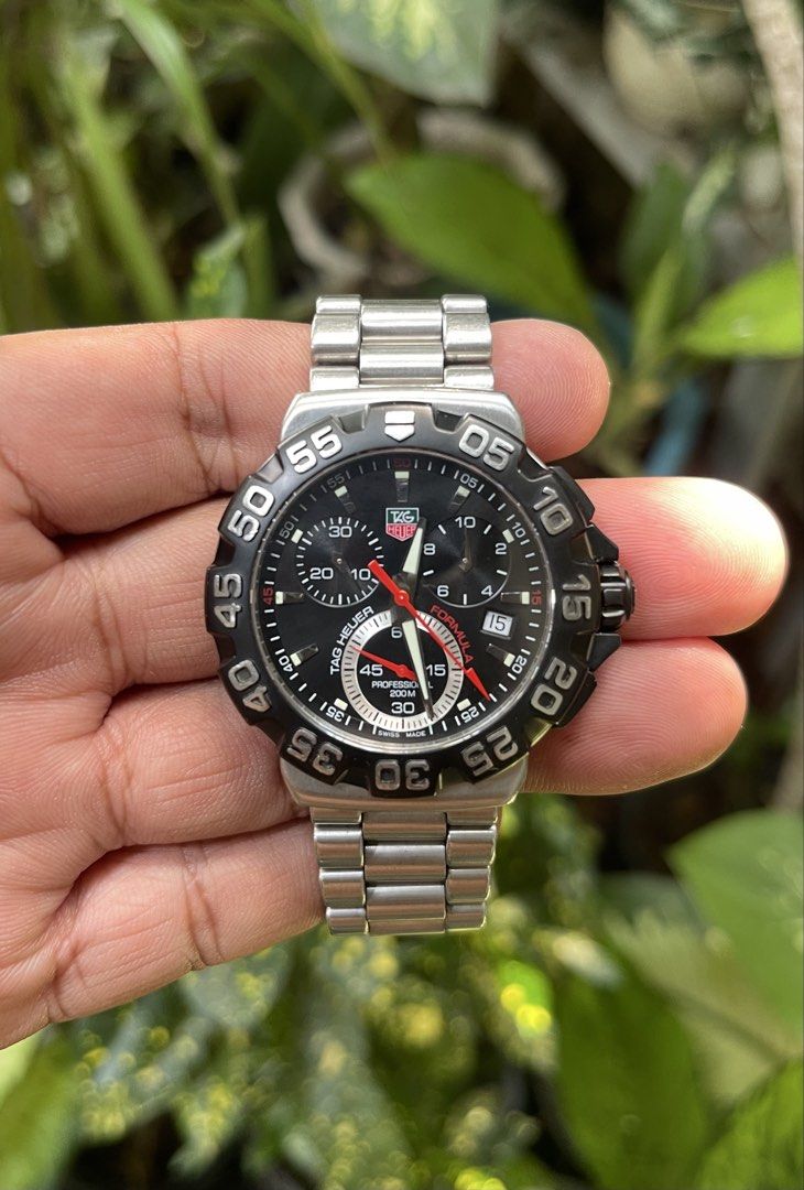 TAG Heuer Formula 1 Professional Watch (Category: Men's Watches) located in Manila. Submitted by crank22 (Listing ID 1462093418, Image 1). Description: - Authentic TAG Heuer Formula 1 watch - Features a sleek black dial with striking red accents - Durable stainless steel bracelet - Comes with its original box - Ideal for both everyday wear and active sports Watch n double box .