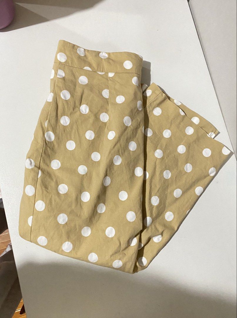 Tan Polka Dot Midi Skirt (Category: Skirts) located in Iloilo. Submitted by luckyeagle_1c5618 (Listing ID 1462149847, Image 2). Description: - Cute tan skirt with white polka dots - Midi length - Back zipper closure - Versatile for casual or dressy outfits - Easy to pair with various tops.