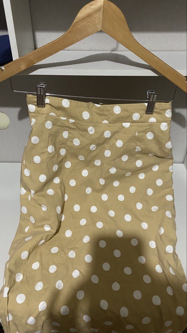 Tan Polka Dot Midi Skirt (Category: Skirts) located in Iloilo. Submitted by luckyeagle_1c5618 (Listing ID 1462149847, Image 1). Description: - Cute tan skirt with white polka dots - Midi length - Back zipper closure - Versatile for casual or dressy outfits - Easy to pair with various tops.