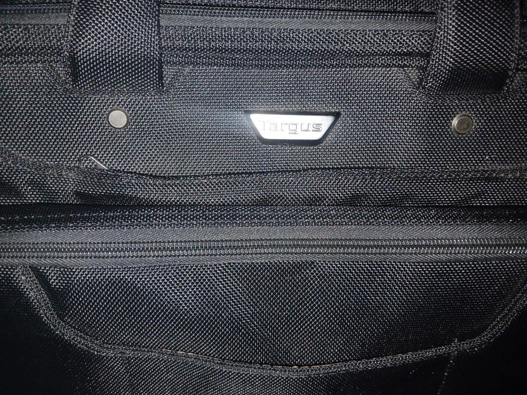 Targus Checkpoint Friendly Laptop Bag (Category: Laptop Bags & Sleeves) located in Manila. Submitted by co.kirara (Listing ID 1462083275, Image 2). Description: 6 Compartments Magnetic Handle Can Fit 2 Laptop Have protective sides foam for laptop Have Strap Have Compartments for Usb, Documents, Etc.. (bought in us, authentic).