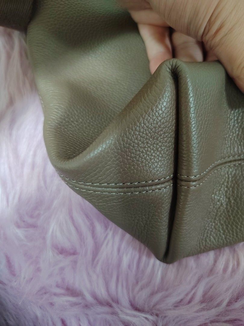 Taupe Leather Crossbody Bag with Adjustable Strap (Category: Cross-body Bags) located in Valenzuela. Submitted by glitter_preloved (Listing ID 1462124244, Image 1). Description: - Chic taupe crossbody bag - Genuine pebbled leather - Spacious main compartment with secure zip closure - Comfortable, adjustable fabric strap - Ideal for daily use - Clean interior.