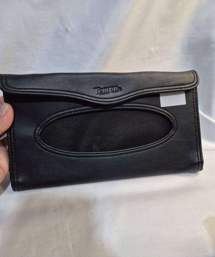 Tempo Black Leather Tissue Holder Pouch (Category: Purses & Pouches) located in Manila. Submitted by princessahshop (Listing ID 1462138383, Image 1). Description: For sale! Tissue holder (pwede isabit sa car/ebike)As Is ₱99 only + sf ♦️Synthetic leather material ♦️Issue may rubs n ung sabitan sa likod.