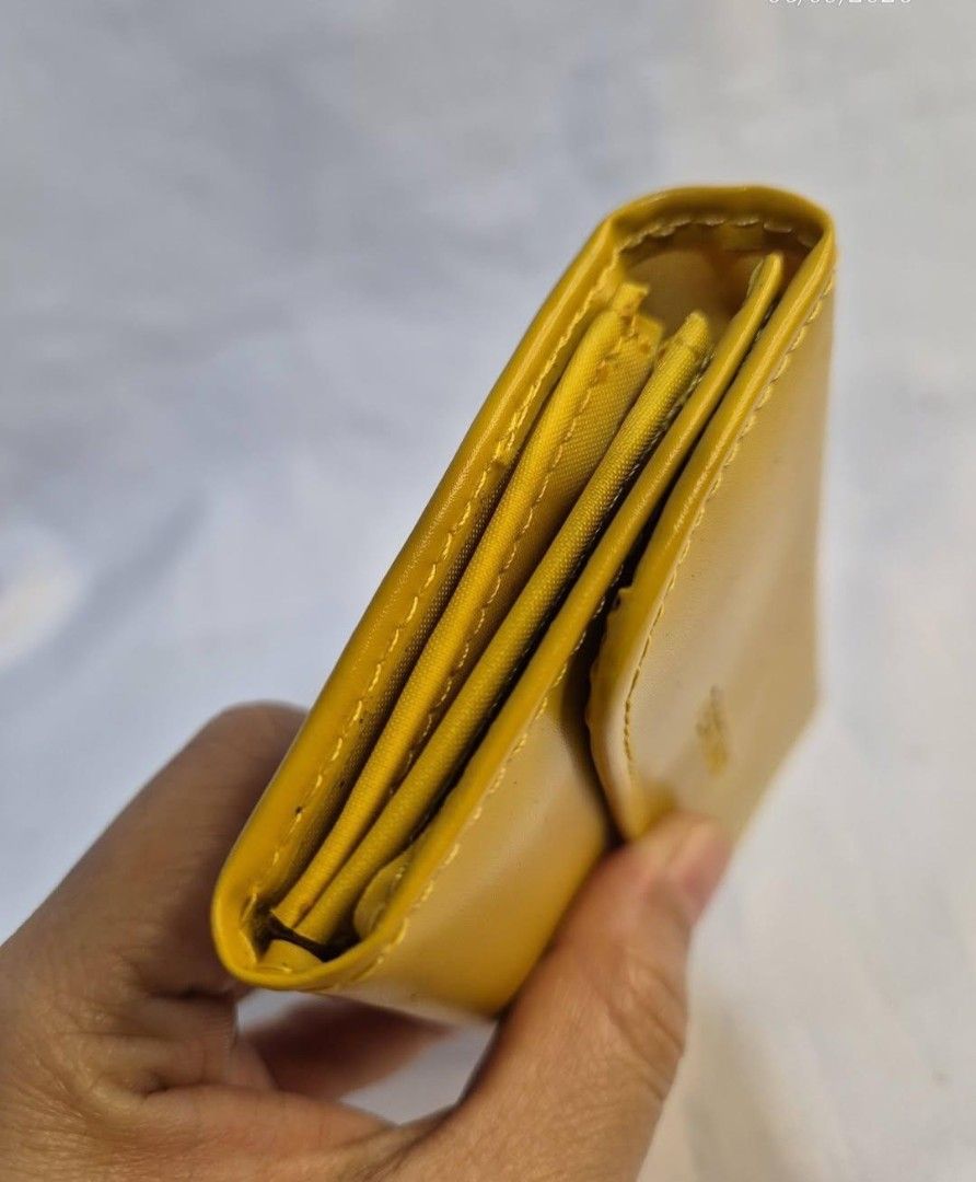 TESTIMO Yellow Leather Tri-fold Wallet (Category: Wallets & Card holders) located in Manila. Submitted by princessahshop (Listing ID 1462140222, Image 3). Description: Card wallet/ coin purse ₱199 only + sf 🥀No issue 🥀Synthetic leather material 🥀Minimal sign of use.