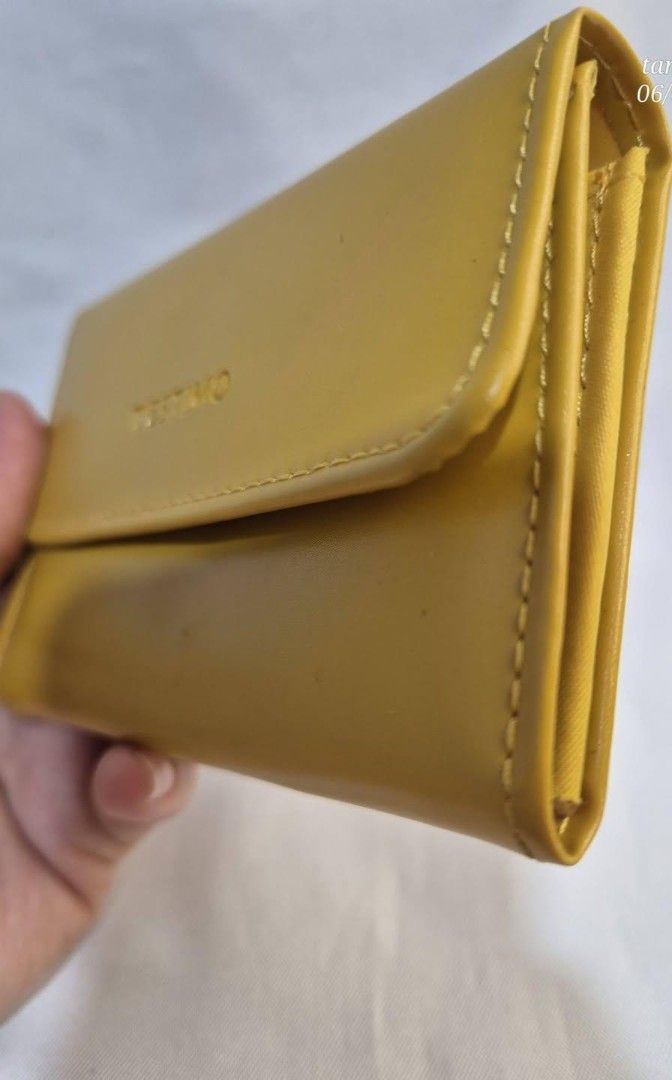 TESTIMO Yellow Leather Tri-fold Wallet (Category: Wallets & Card holders) located in Manila. Submitted by princessahshop (Listing ID 1462140222, Image 2). Description: Card wallet/ coin purse ₱199 only + sf 🥀No issue 🥀Synthetic leather material 🥀Minimal sign of use.