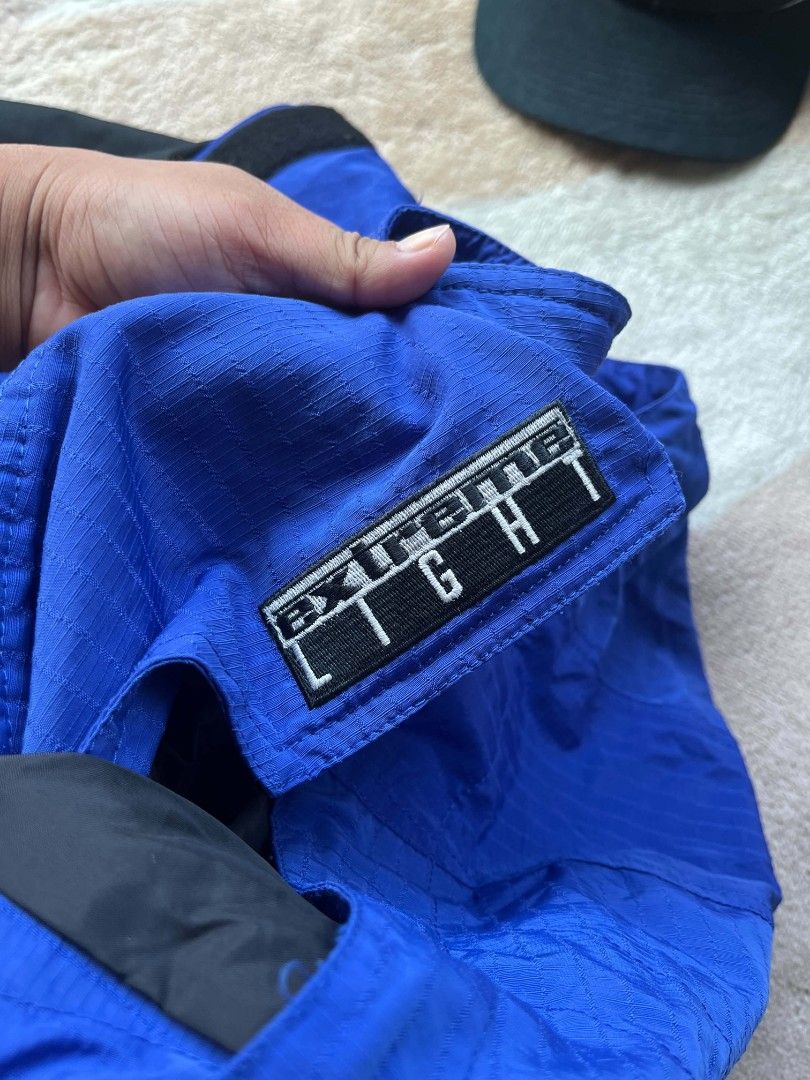 The North Face Extreme Light Jacket Blue Black (Category: Coats, Jackets and Outerwear) located in Baler. Submitted by jaydeebaltazar (Listing ID 1462161382, Image 3). Description: - Blue and black The North Face jacket - 'Extreme Light' tag - Hooded design - Zip and button closure - Adjustable drawstring at the waist - Ideal for outdoor activities.
