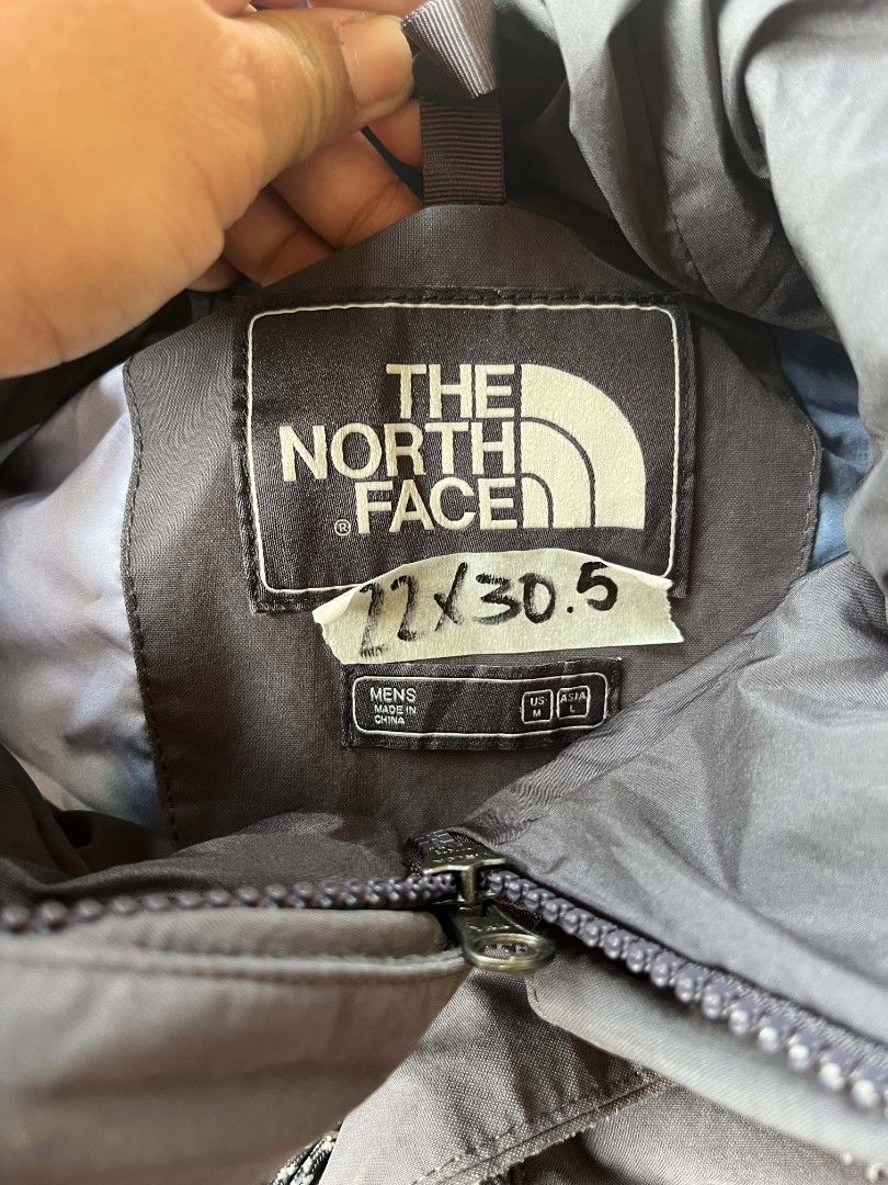 The North Face Men's Jacket (Category: Coats, Jackets and Outerwear) located in Baler. Submitted by jaydeebaltazar (Listing ID 1462161780, Image 3). Description: - Brand: The North Face - Color: Grey - Size: Men's Medium (M) - Features: Hooded, multiple pockets - Zippers: High-quality YKK - Ideal for: Outdoor activities, hiking, camping - Condition: Great (check label for details).