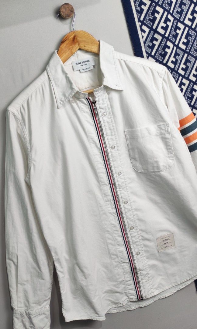 Thom Browne Zippered Polo Jacket (Category: Coats, Jackets and Outerwear) located in Baguio. Submitted by luxuryph2600_eric (Listing ID 1462187951, Image 3). Description: Thom Browne size 2 📌 Details⬇️⬇️⬇️ 📍Excellent Condition 📍Dimes 22*27 📍Color Rate 10/10 📍Size Medium 💰 PRICE 1500 FREE SHIPING 📌Loc. Baguio City Shipping Via J&T Reminder : Items are Thrifted and carefully Selected from Thrift Stores/Box/Bales Photos are Provided for Self 