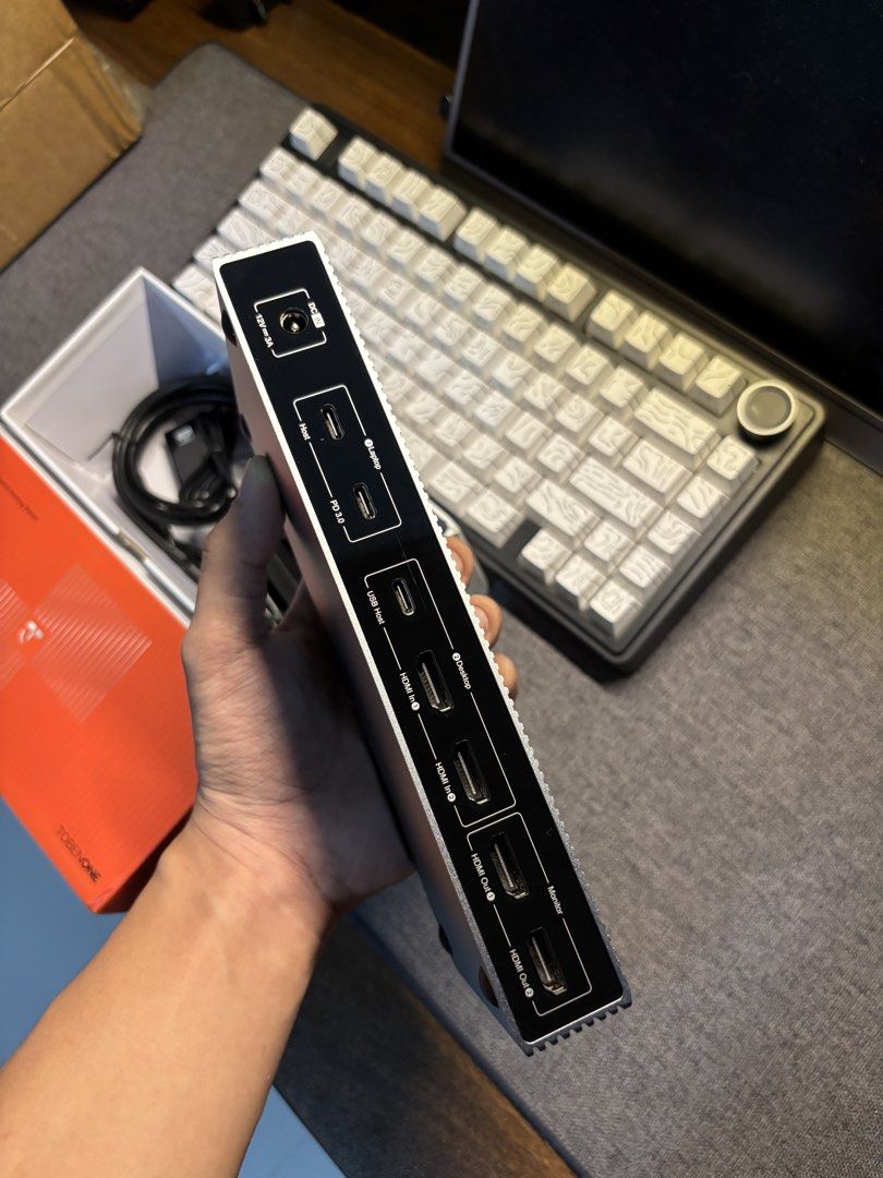 TOBENONE TKM001 USB-C Docking Station (Category: Other Accessories) located in Bacolor. Submitted by kxnyleofficial (Listing ID 1462066347, Image 3). Description: TOBENONE TKM001 Docking Station 10,000 still negotiable - Multiple USB-A and USB-C ports - High-speed USB-C with 10Gbps and Power Delivery (PD) - HDMI outputs for connecting monitors - Convenient headphone jack - Includes original box and accessories - Perfect for expanding laptop conne