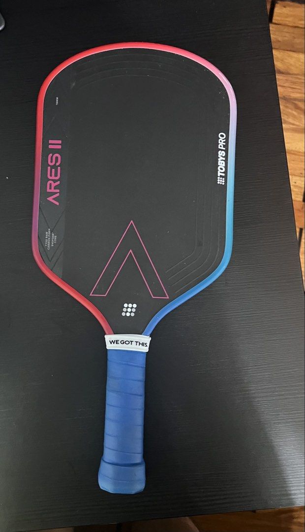 Toby's Pro Ares II Pickleball Paddle (Category: Racket and Ball Sports) located in Pasig City. Submitted by bbt07 (Listing ID 1462054199, Image 1). Description: - Toby's Pro Ares II pickleball paddle - Carbon fiber surface for powerful shots - Honeycomb core for excellent control - Features a motivational 'We Got This' grip - Perfect for your next pickleball match.