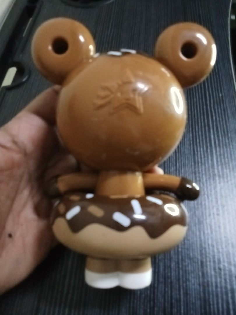 Tokidoki Donut Themed Figure (Category: Designer & Blind Box Toys) located in Marikina City. Submitted by truecat_6654e7 (Listing ID 1462215467, Image 2). Description: - Adorable donut-themed collectible figure - Tokidoki-inspired design - Features brown and white colors with chocolate donut details - Cute donut-shaped ears - Stands on white shoes - Ideal for collectors or as a fun desk decoration.