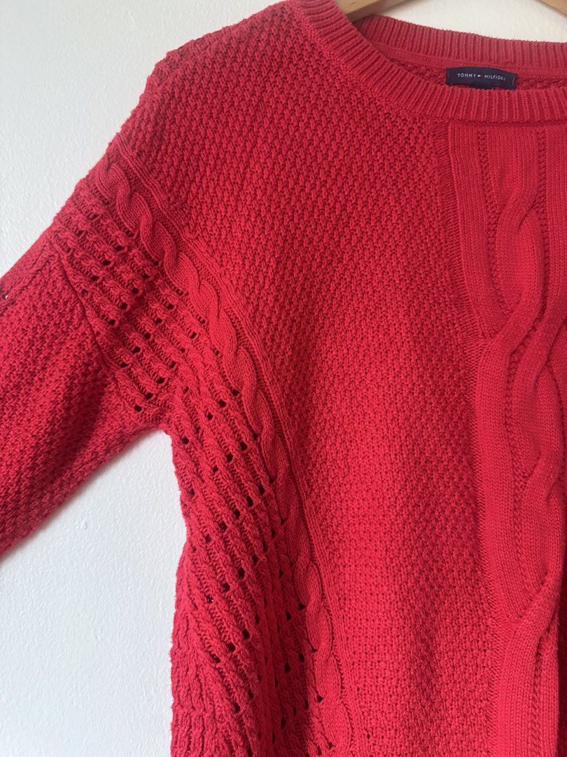 Tommy Hilfiger Red Cable Knit Sweater Size M (Category: Longsleeves) located in Paranaque City. Submitted by simplylizzy (Listing ID 1462075479, Image 3). Description: - Classic red Tommy Hilfiger sweater - Size: Medium - Cable knit design down the front - Textured knit all over - Open knit details on the sides - Crew neck, long sleeves - Ideal for layering or wearing solo.