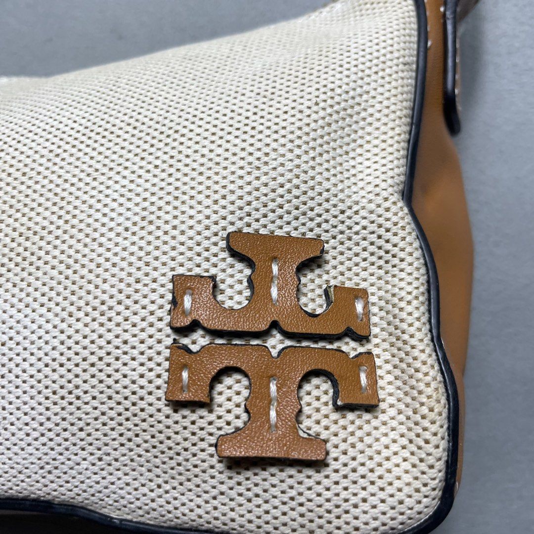 TORY BURCH MCGRAW CANVAS WEDGE BAG (Category: Shoulder Bags) located in Manila. Submitted by revise.ph_ (Listing ID 1462218407, Image 2). Description: TORY BURCH MCGRAW CANVAS WEDGE BAG Made in Dimension Height/Length:5 Width:10 Issue:dirt use Price:2,500 Free Shipping via Jnt.