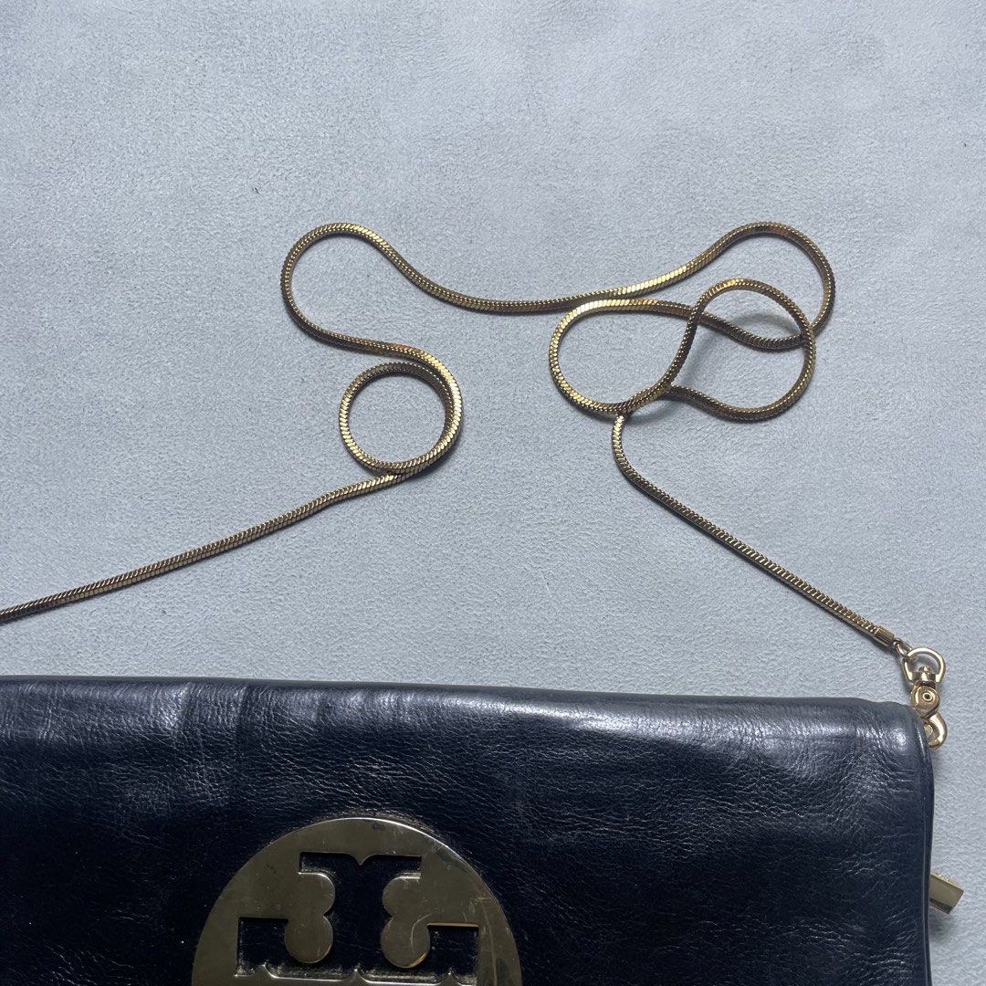 TORY BURCH SLING CLUTCH BAG (Category: Clutches) located in Manila. Submitted by revise.ph_ (Listing ID 1462218593, Image 3). Description: TORY BURCH SLING CLUTCH BAG Made in CHINA Dimension Height/Length:7 Width:12.5 Issue:Replace sling Price:2,000 Free Shipping via Jnt.