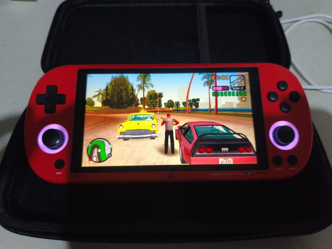 TRIMUI Smart Pro S Handheld Retro Game Console Red (Category: Printers, Scanners & Copiers) located in Mandaluyong City. Submitted by zephyr3 (Listing ID 1462053513, Image 2). Description: - TRIMUI Smart Pro S handheld console with striking red trim. - Loaded with classic games: God of War, GTA Vice City, Super Mario World, and more! - Bright and clear display for an immersive gaming experience. - Comes with a protective case for safe portability