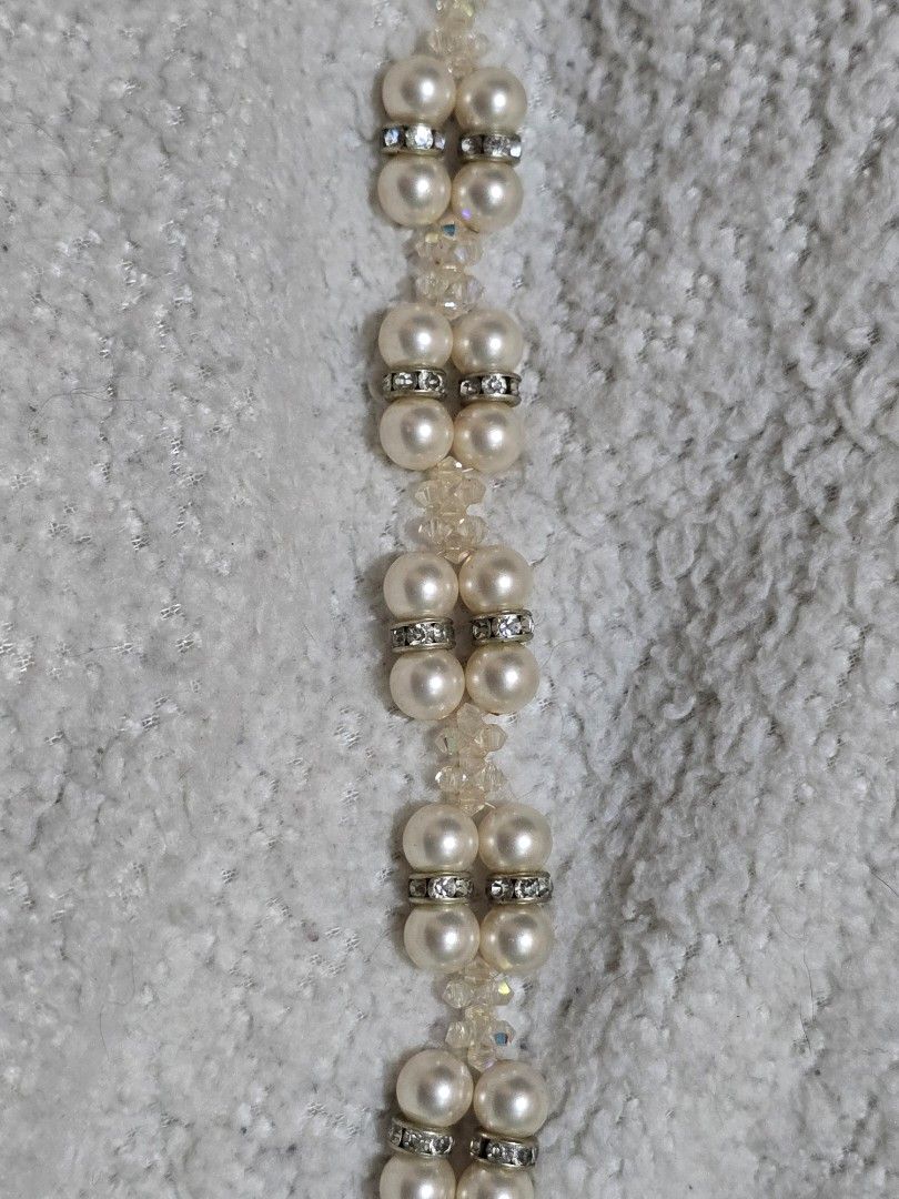 Two strand pearl bracelet (Category: Bracelets) located in Ligao. Submitted by veetrinkets (Listing ID 1462173202, Image 2). Description: -elegant two strand pearl bracelet -square slide clasp mechanism -with swarovski beads and diamond spacer beads.