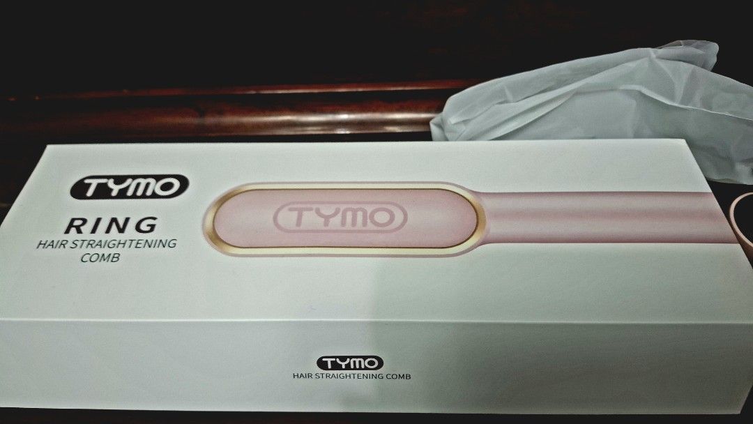 TYMO Ring Hair Straightening Comb Set (Category: Hair) located in Antipolo. Submitted by jimin489 (Listing ID 1462060108, Image 3). Description: - Achieve smooth, straight hair in minutes with the TYMO Ring. - Fast heating: Reaches 350°F in just 30 seconds. - 5 adjustable heat settings suitable for all hair types. - Complete set includes: straightening comb, heat-resistant glove, clips, and travel pouch. - Easy to use for quick touch-ups and ever