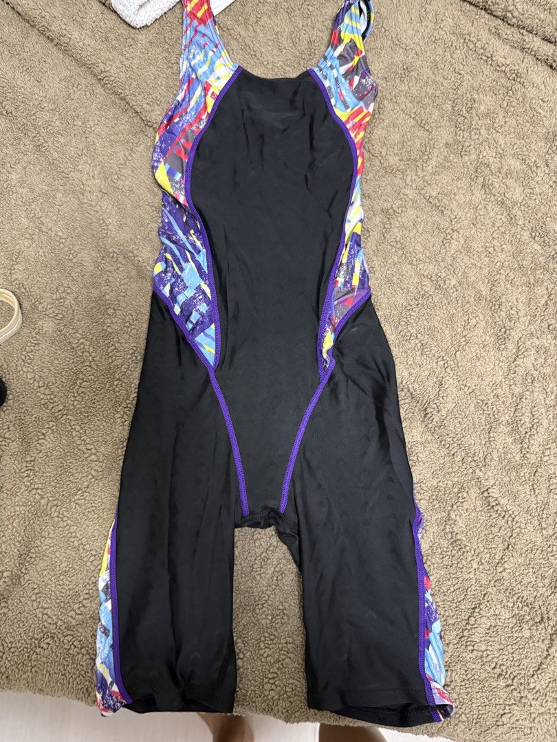 TYR Swimsuit - Geometric Pattern (Category: Bikinis & Swimsuits) located in Cainta. Submitted by marasabu (Listing ID 1462039732, Image 1). Description: TYR swimsuit with a cool geometric pattern. Vibrant colors like purple, pink, and neon green. Great for swimming or training. Comfortable straps and good coverage..