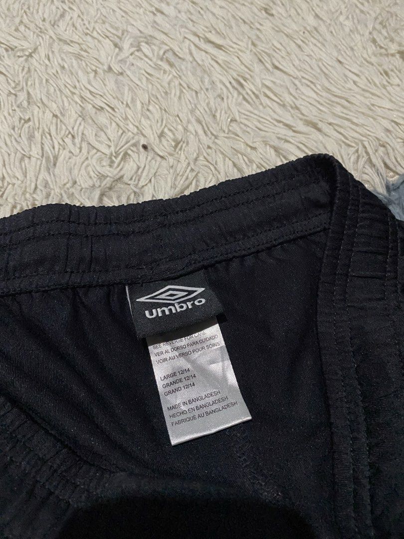 Umbro Black Athletic Shorts Size Large (Category: Shorts) located in Iloilo. Submitted by illcitythriftedco. (Listing ID 1462091758, Image 3). Description: - Black Umbro athletic shorts - Classic Umbro logo on the side - Comfortable elastic waistband - Made in Bangladesh - Size Medium - Ideal for sports and casual wear.