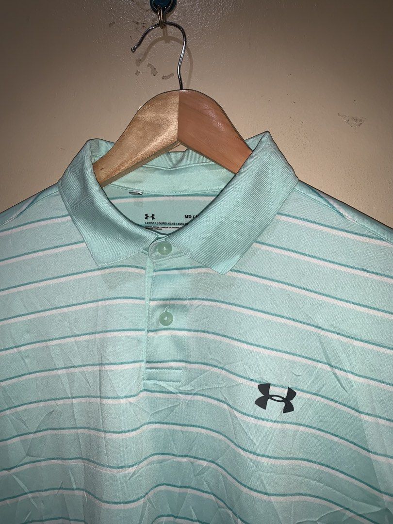 UNDER ARMOUR poloshirt (Category: Tshirts & Polo Shirts ) located in Molave. Submitted by mysticbird_38213e (Listing ID 1462202261, Image 2). Description: Heat gear , lose fit As new condition No issue Washable dirt - sobrang ganda po sa personal hindi lang kagandahan sa personal hindi kasi maganda yung back ground ko kaya hindi ma appreciate yung kulay niya hihi.
